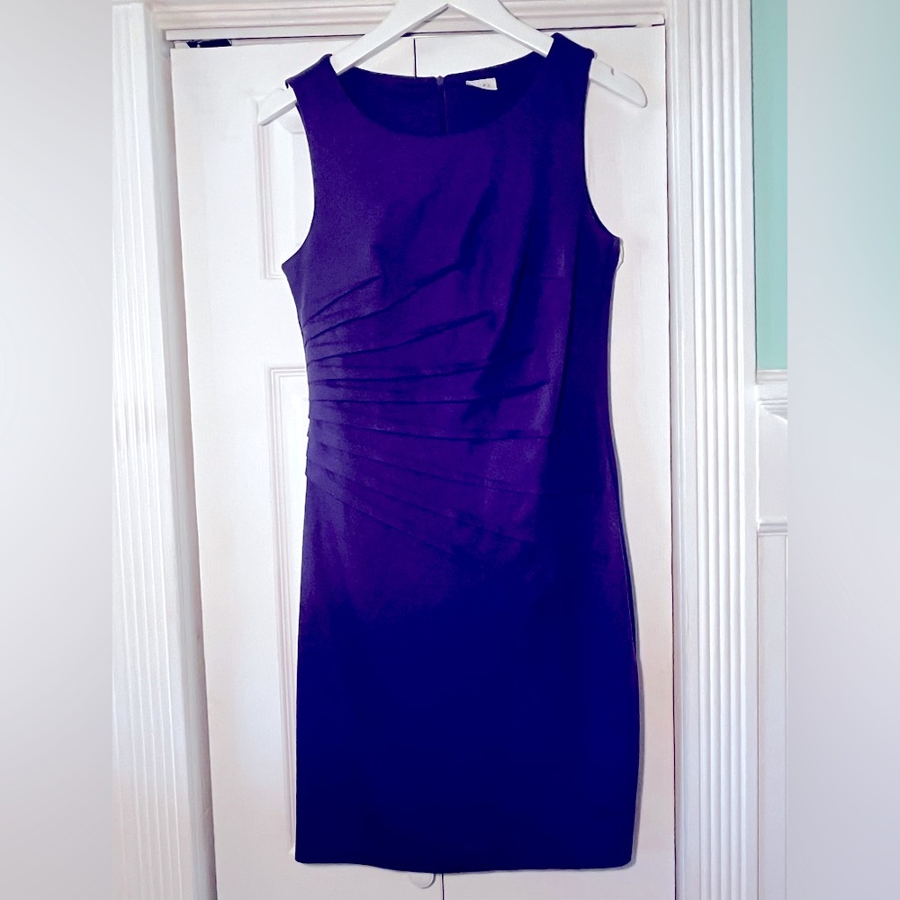 Purple fitted pencil dress with side ruching.
